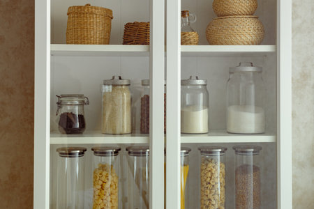 a cook's essential store cupboard ingredients, zero waste storage. Country kitchen setting. Dried food supplies.の写真素材