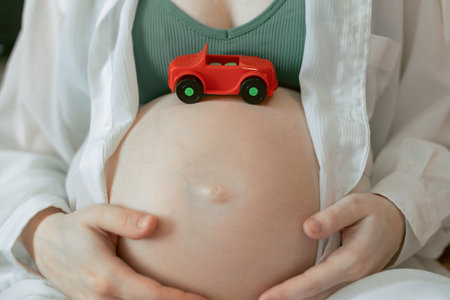 Pregnant Woman with a little toy car, Preimplantation genetic diagnosis