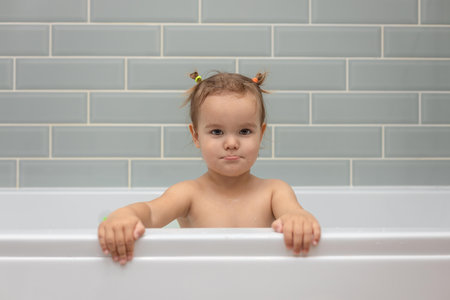 child bathing in a bathtub, bathing timeの写真素材