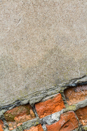 Old red textured brick wall as background.