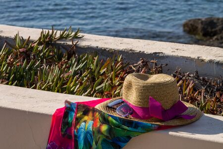 Sun straw hat against the sea.の写真素材