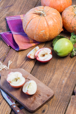 Closeup of freshly harvested fruits and vegetables. Organic pumpkins and red apples.の写真素材