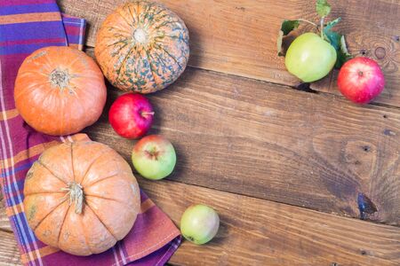 Closeup of freshly harvested fruits and vegetables. Organic pumpkins and red apples.の写真素材
