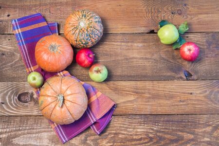 Closeup of freshly harvested fruits and vegetables. Organic pumpkins and red apples.の写真素材