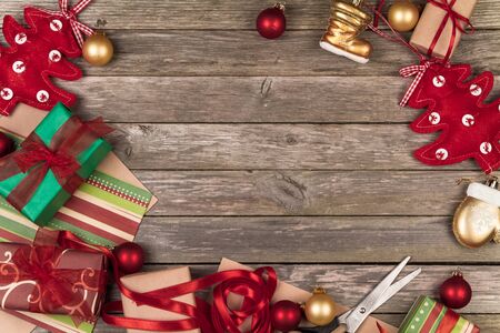 Christmas ornaments and gifts on a gray wooden background.の写真素材