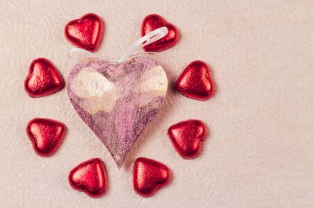 St. Valentines Day heart and sweets in a red brilliant wrapper.の写真素材
