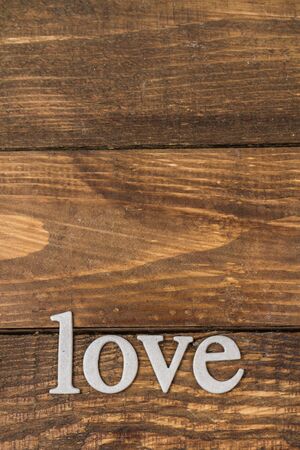 Word "love" on a wooden background.の写真素材