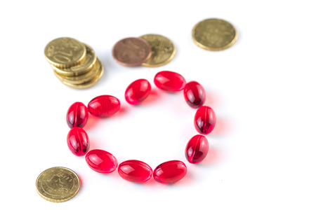 Medical and coins on a white background.の写真素材