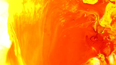 Blue orange yellow abstract background. Tinted background with copy space for design. The colors were immersed in liquid and photographed in motion. abstract compositionの写真素材