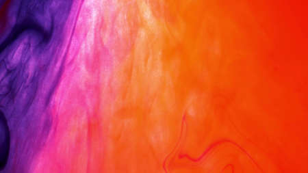 Multicolored watercolor abstract background, hand-drawn. Texture of yellow, orange, purple and purple multicolored spots and splashesの写真素材