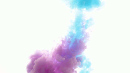 An explosion of colored paints in water on a white backgroundの写真素材