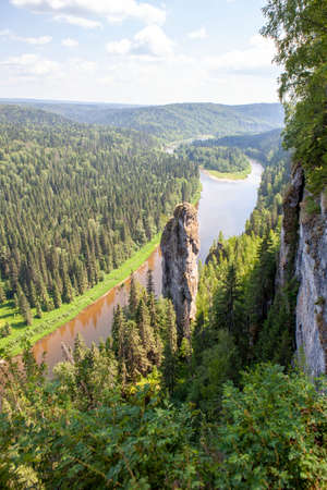 The picturesque Devil's Finger rock overlooking the Usva River. Massif Usvinskie Pillars. Perm Territory. Russiaの写真素材