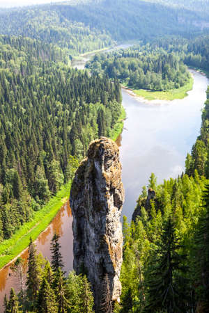The picturesque Devil's Finger rock overlooking the Usva River. Massif Usvinskie Pillars. Perm Territory. Russiaの写真素材