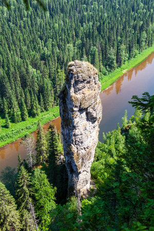 The picturesque Devil's Finger rock overlooking the Usva River. Massif Usvinskie Pillars. Perm Territory. Russiaの写真素材