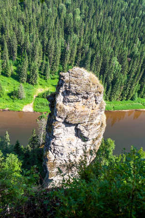 The picturesque Devil's Finger rock overlooking the Usva River. Massif Usvinskie Pillars. Perm Territory. Russiaの写真素材