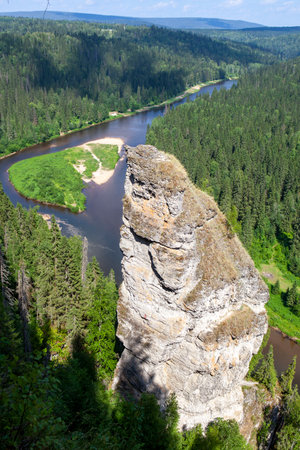 The picturesque Devil's Finger rock overlooking the Usva River. Massif Usvinskie Pillars. Perm Territory. Russiaの写真素材