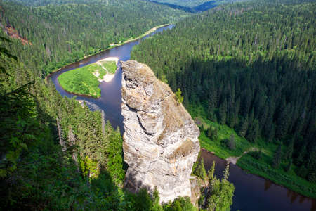 The picturesque Devil's Finger rock overlooking the Usva River. Massif Usvinskie Pillars. Perm Territory. Russiaの写真素材