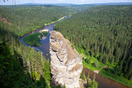 The picturesque Devil's Finger rock overlooking the Usva River. Massif Usvinskie Pillars. Perm Territory. Russiaの写真素材