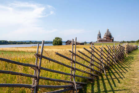 Wattle with the Church of the Transfiguration of the Lord, the Church of the Intercession of the Virgin and the bell tower. Kizhi Island. Republic of Karelia. Russiaの写真素材