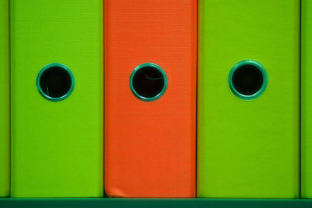 Very colorful files on shell in dark roomの写真素材