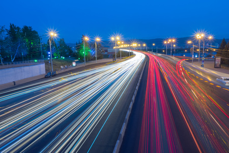 the citys skyline. car traffic at nightの写真素材