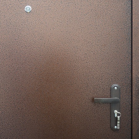 metal door with spy-hole close-upの写真素材