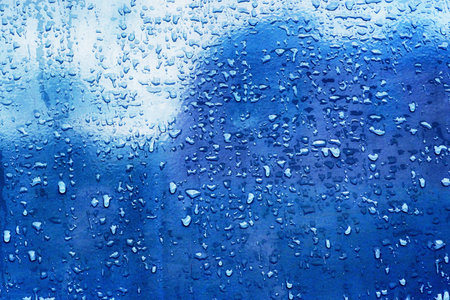 water drops on metallic surface close upの写真素材