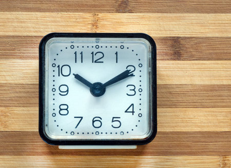 old alarm clock on a wooden table