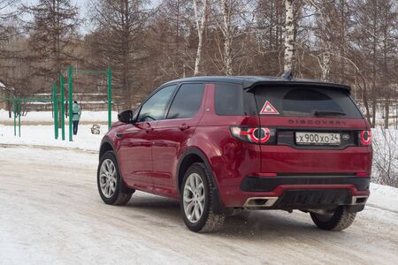 Krasnoyarsk/Russia-December 07 2017: discovery car in red on a winter roadのeditorial素材