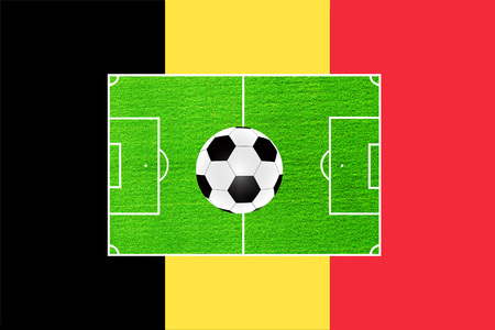 football on the background of the field and the flag of Belgium.の写真素材