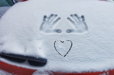 Closeup of wipers and frosted car windshield covered with ice and snow. Winter weather, transportation conceptの写真素材