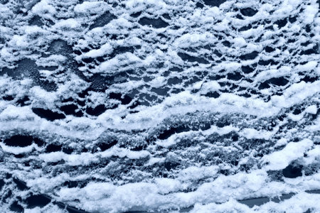 frozen glass of a car on a winter day.
