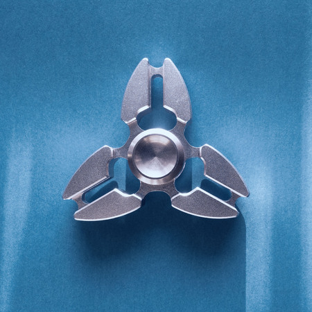 spinner close-up on blue background.の写真素材