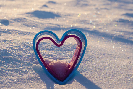 image of two hearts in the snow.の写真素材