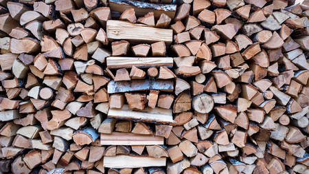 Large stack of firewood. Close-up wood texturesの写真素材