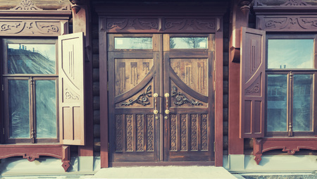 The facade of an old wooden house after restoration.の写真素材