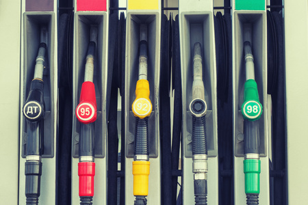 fuel dispensing nozzles at the gas stationの写真素材