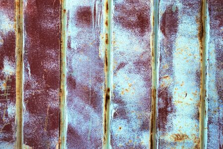 Iron surface is covered with old paint, texture background.の写真素材