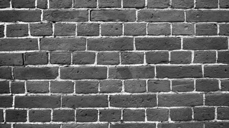 Black and white or monochrome and close up beautiful the old brick wall from an ancient period background and texture for architectureの写真素材
