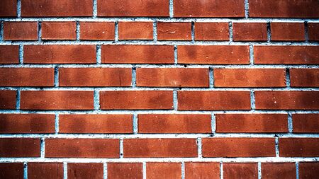 Red brick wall close up texture backgroundの写真素材