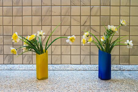 decorative flowers in two vases on the table.の写真素材