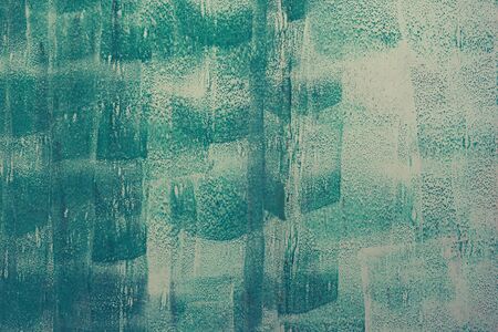 Iron surface is covered with old paint, chipped paint, texture background.の写真素材