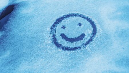 drawing on the windshield of the car, winter weather.の写真素材
