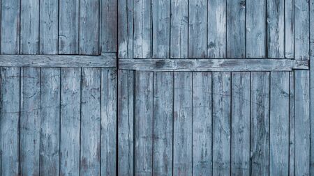old wooden fence blue close upの写真素材