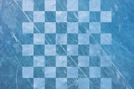 chess Board made of snow and ice, winter background.の写真素材