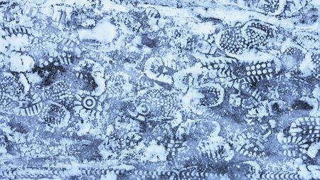 footprints on the footpath in the Park in winter.の写真素材