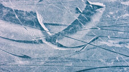 patterns on the surface of ice and snow, winter concept.の写真素材