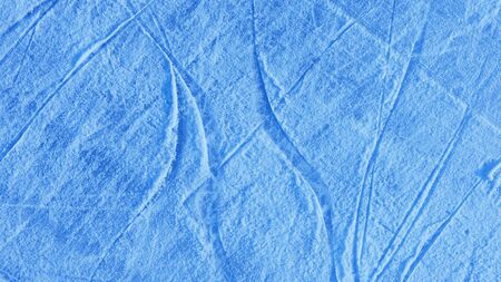Abstract background of scratches on the light blue ice surface.の写真素材