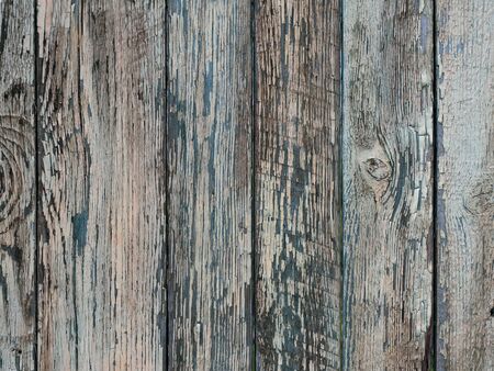 Old wooden fence with cracked paint texture.の写真素材