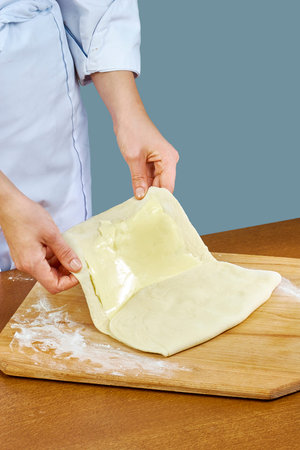 Woman rolls squeezes dough Handmade Series Food recipes